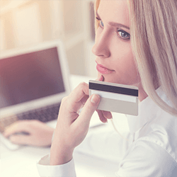 blondy-with-laptop-holding-a-creditcard copy