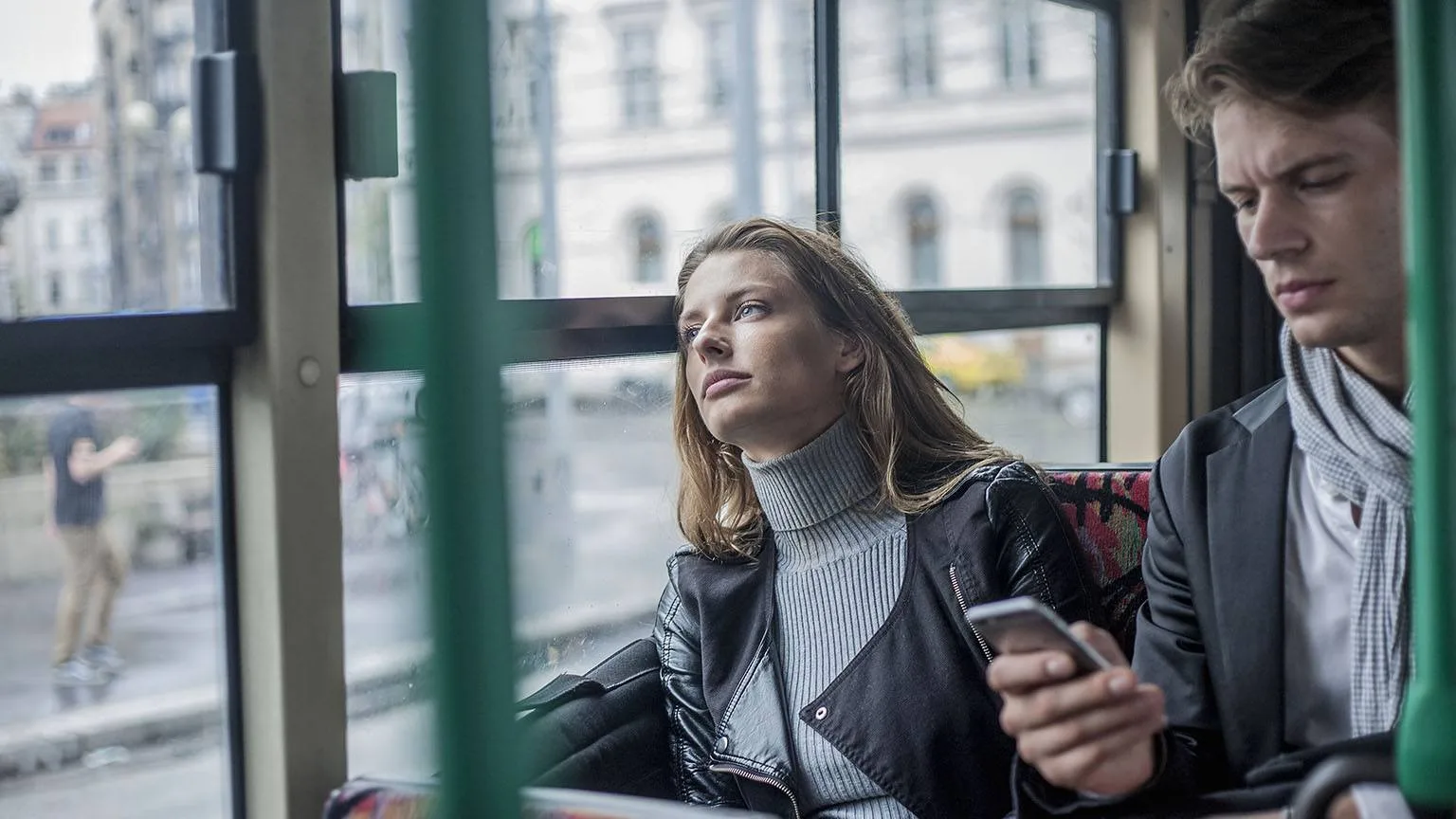 Image: Getty Images Couple commuting by bus