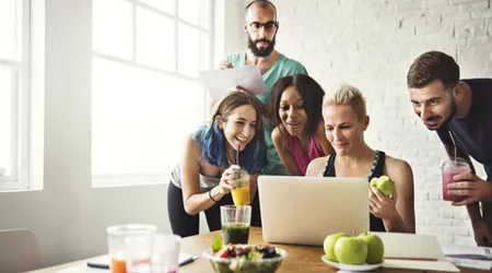 Healthy people sitting at a table_small_shutterstock Healthy group of people eating together
