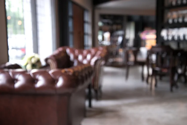 blurry leather lounges coffee shop