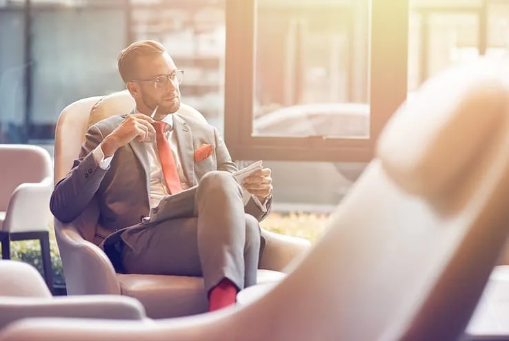 Businessman in airport lounge