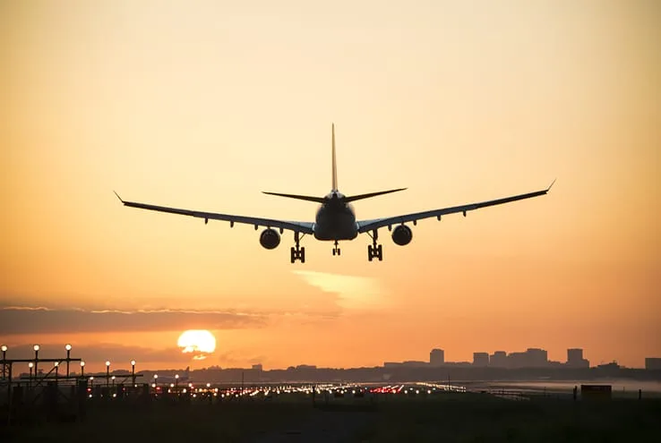 plane landing at during golden hour