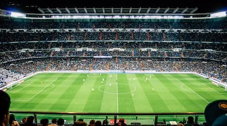 Feel the roar of the crowd as you cheer on your favourite team in the stadium