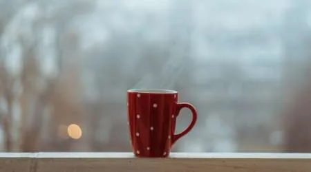 Steaming cup (of coffee) on a foggy morning Steaming cup (of coffee) on a foggy morning