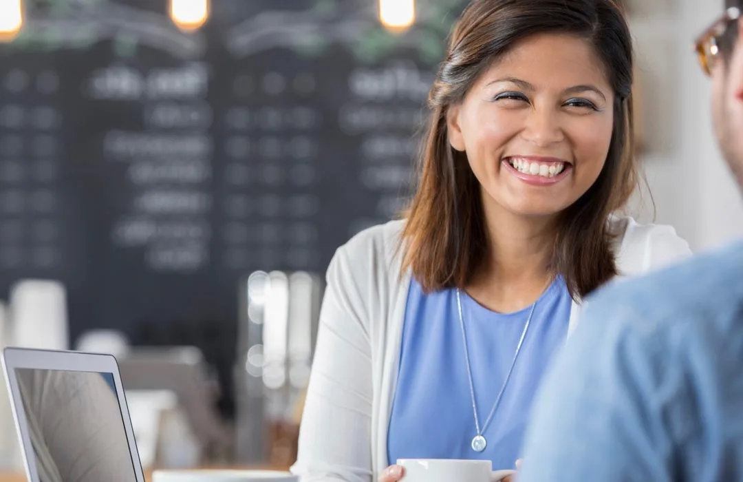 Image: Supplied Woman's happy using her laptop.
