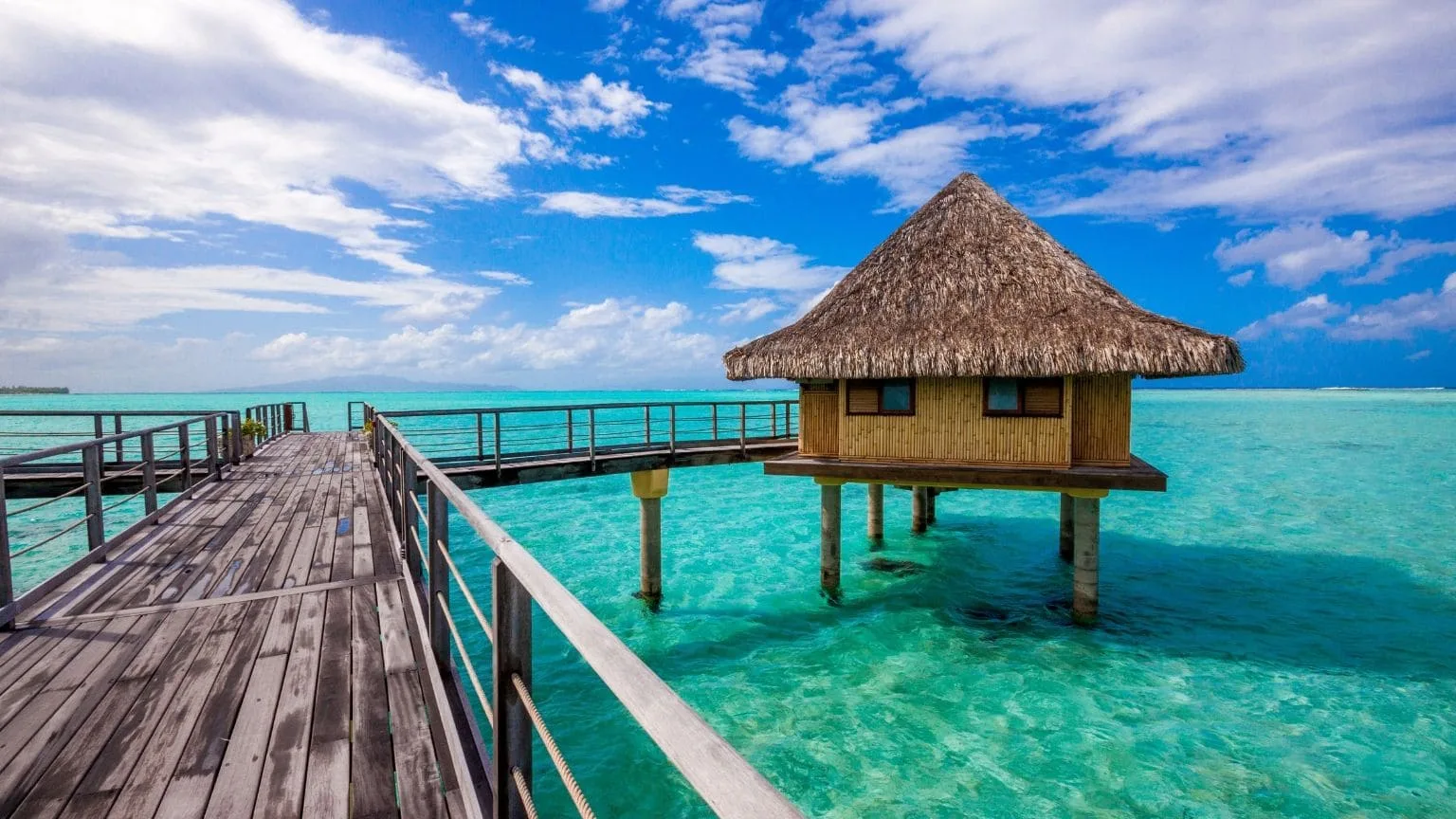 Image: Shutterstock Nipa hut by the beach, French Polynesia