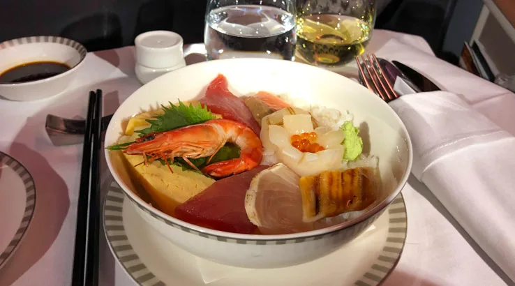 Image: Shing Kam/Finder Chirashi sushi bowl: prawns, squid, salmon and tuna sashimi, and egg