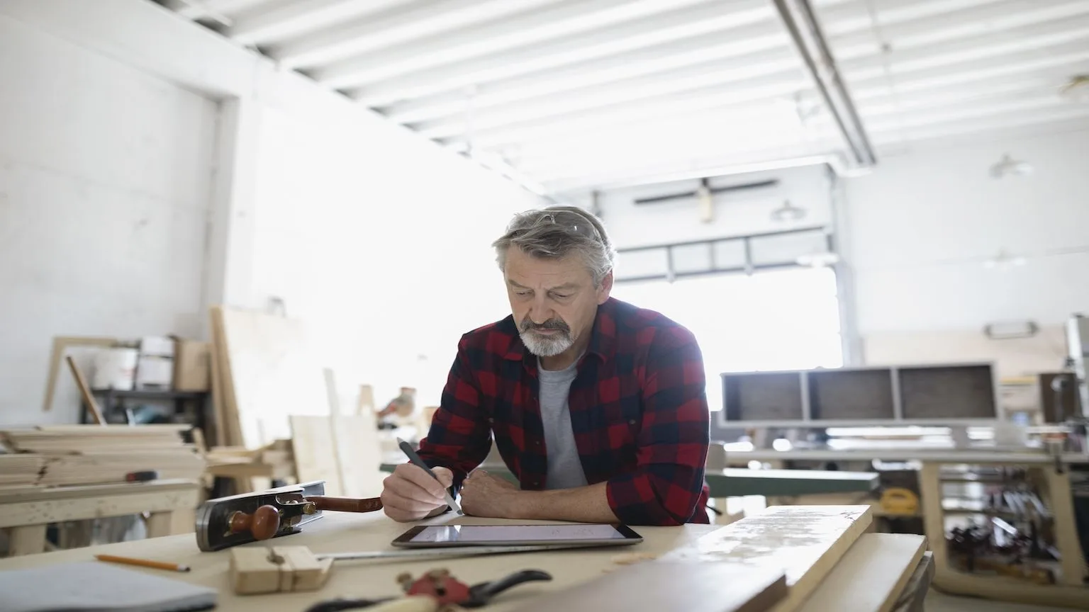 Image: Getty Images Older Business Man on Tablet