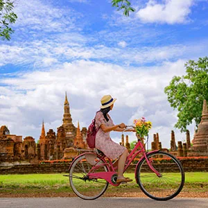 Image: Getty Images woman on a bike in bangkok