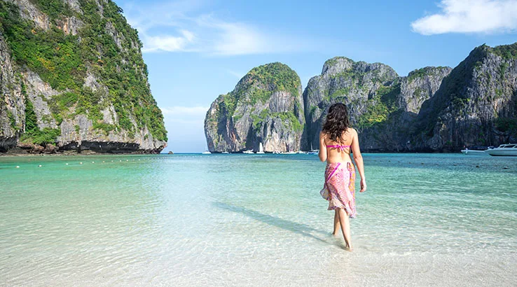 Adult woman in bikini on tropical beach, Thailand Adult woman in bikini on tropical beach, Thailand