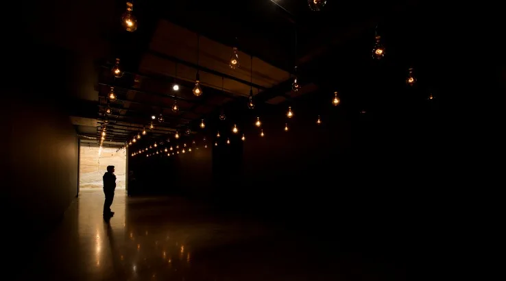 Image: Supplied Man standing inside Mona art gallery in Tasmania.