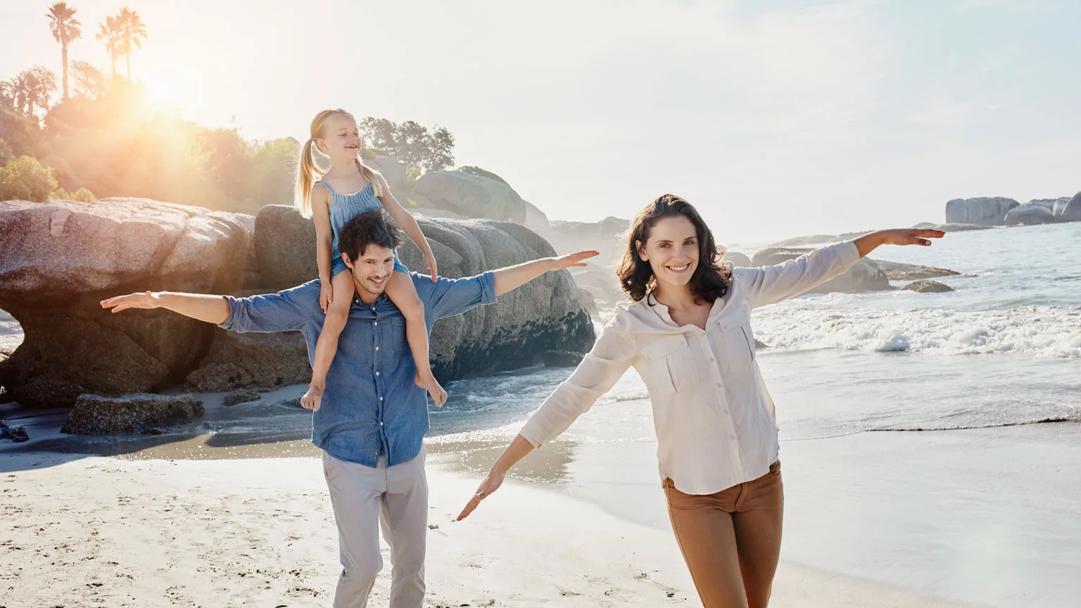 Image: Getty Images Happy family with daughter on the beach