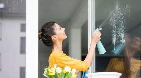 https://dvh1deh6tagwk.cloudfront.net/finder-au/wp-uploads/2020/11/Smiling-woman-at-home-cleaning-the-window_GettyImages_450x250.jpg