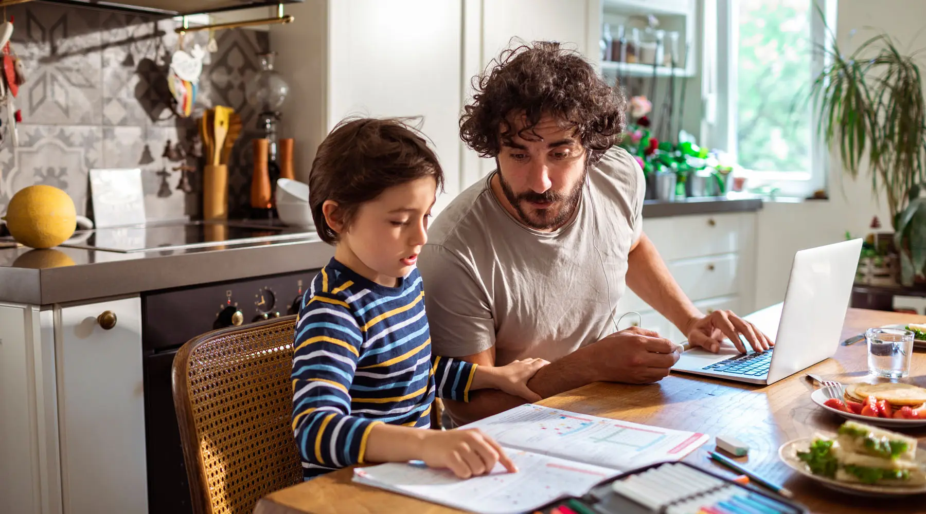 father_helping_his_son_with_schoolwork_1800x1000px father_helping_his_son_with_schoolwork_1800x1000px