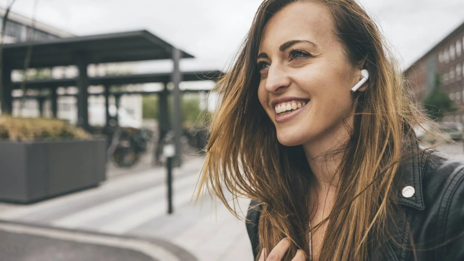 Image: Getty Images Woman wearing Apple Airpods