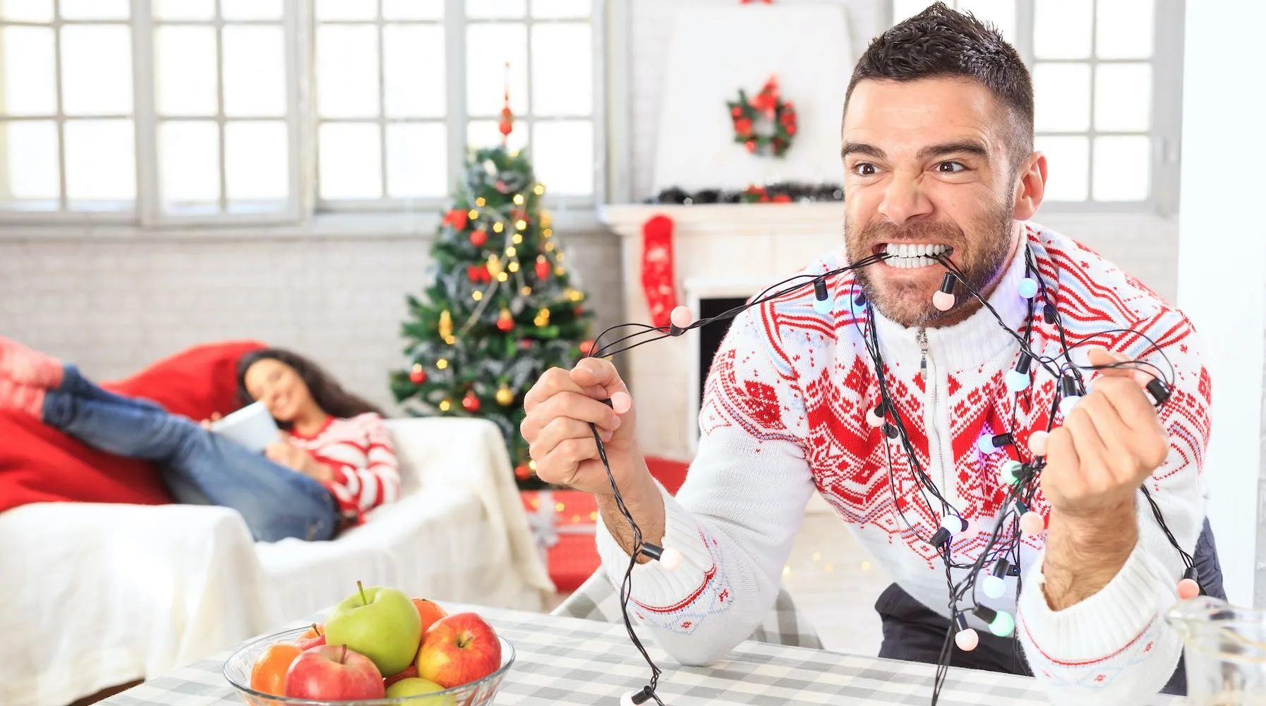 Young couple at home for Christmas Young couple at home for Christmas