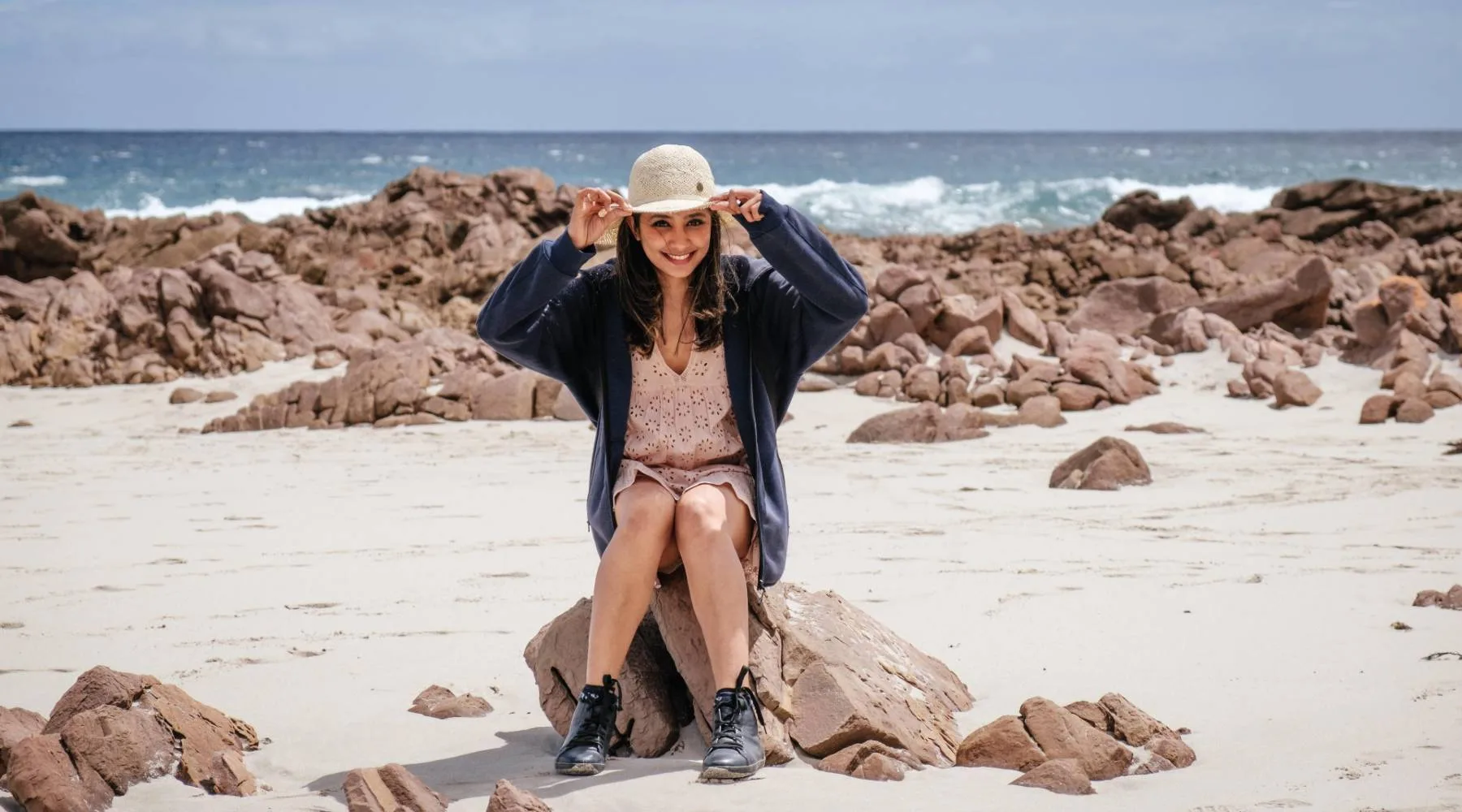 Womanonbeachholdinghat_Unsplash_1800x1000 Womanonbeachholdinghat_Unsplash_1800x1000
