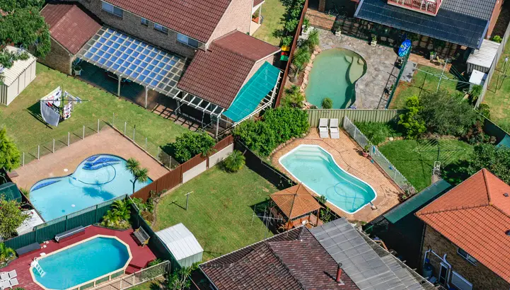 Stereotypical Australian backyards with swimming pools, house, suburb in Sydney, Australia, aerial photography Stereotypical Australian backyards with swimming pools, house, suburb in Sydney, Australia, aerial photography