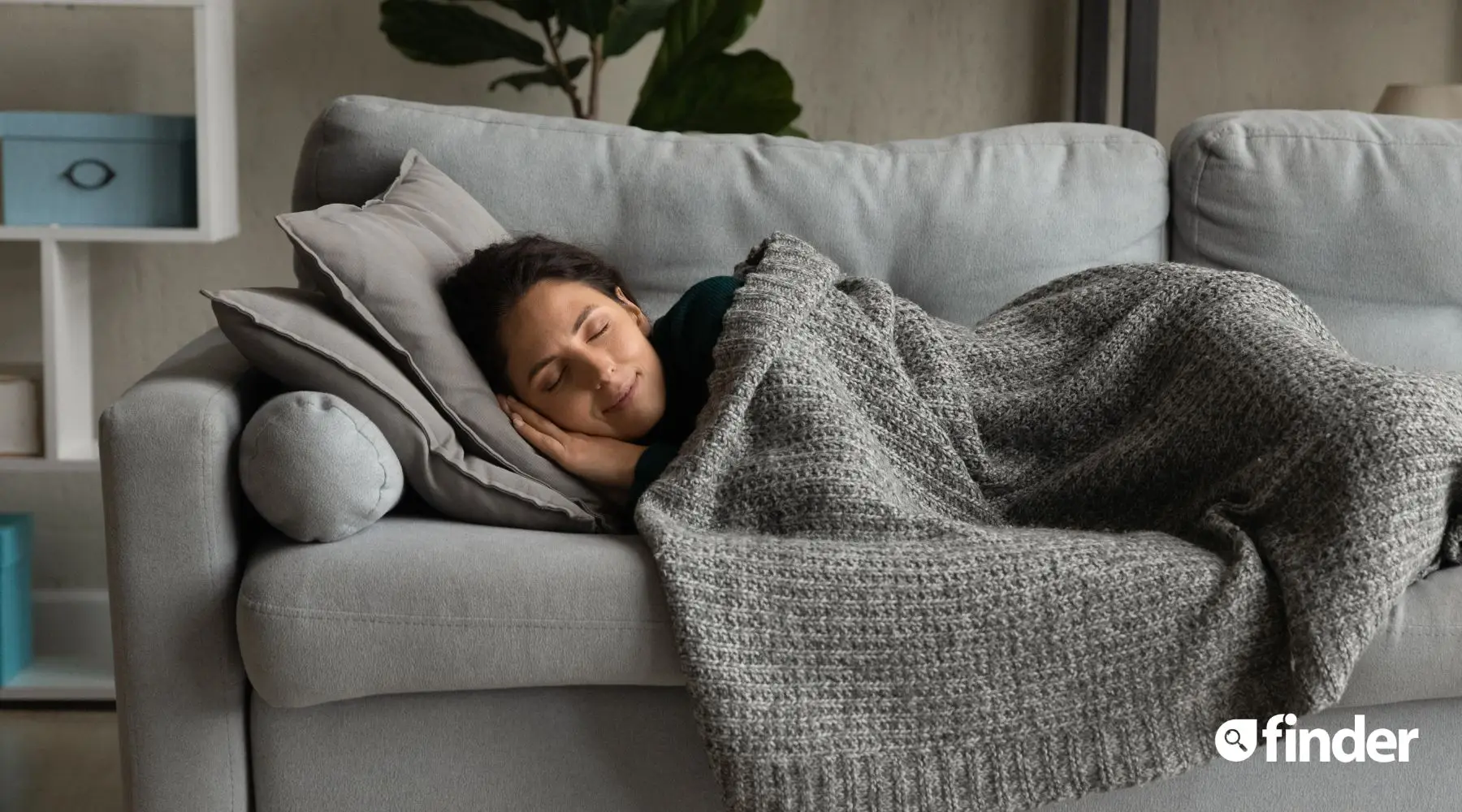 Young woman sleeping on sofa bed