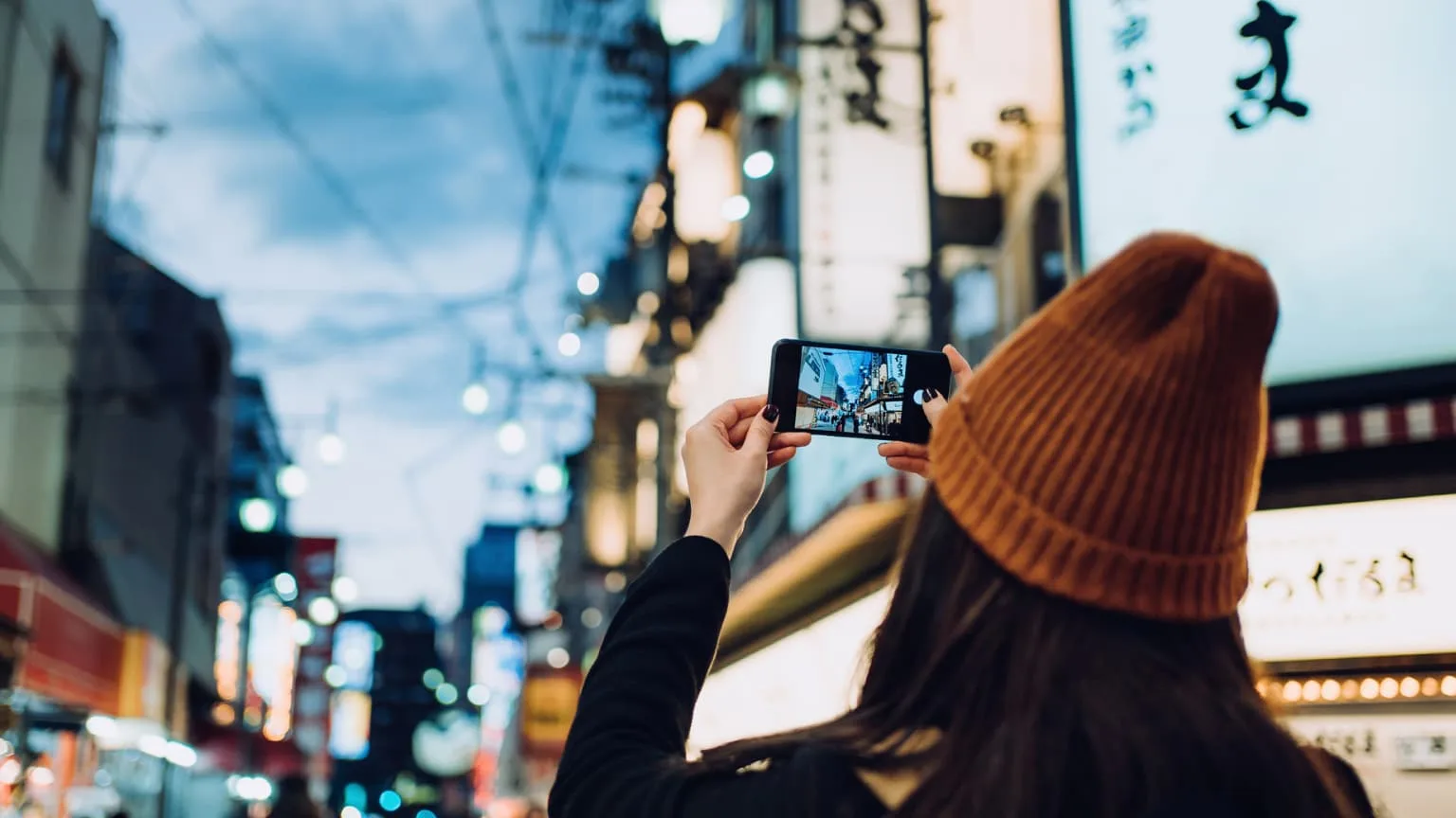 Image: Getty Images woman taking photo in Kyoto