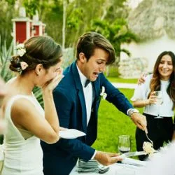 Image: Getty Images Bride and groom cutting cake