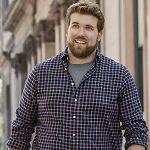 Blonde guy smiling