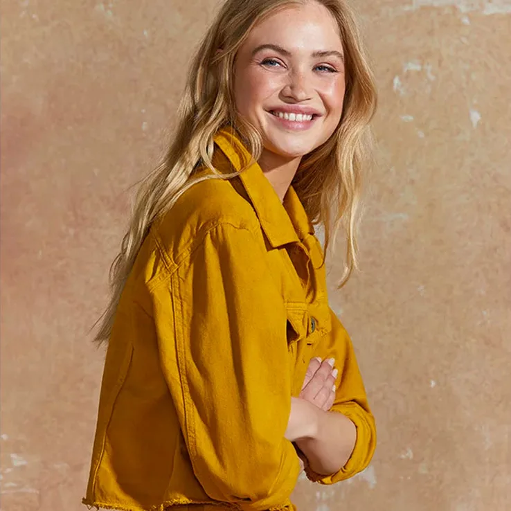 Smiley blond woman with yellow jacket