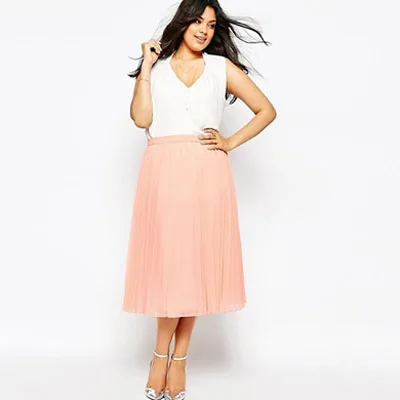 Curvy girl wearing pink dress white blouse