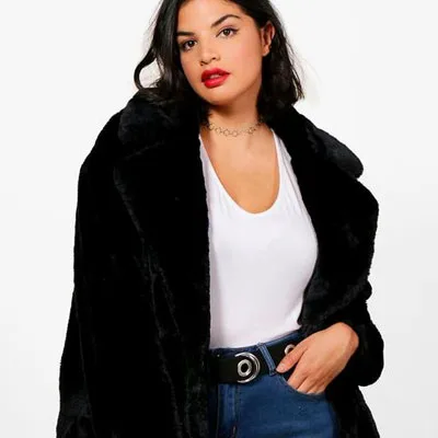 Curvy girl wearing black coat