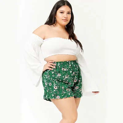 Curvy chic wearing white top