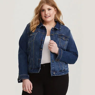 Blonde curvy girl wearing denim jacket