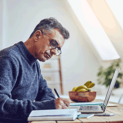 Image: Getty Images Senior man computing expenses