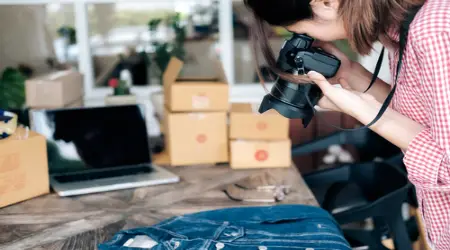 Woman taking a photo of things to sell online