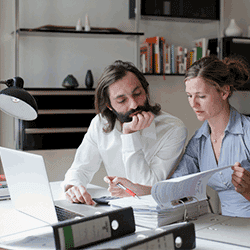 Image: Getty Images Couple working out finances at home