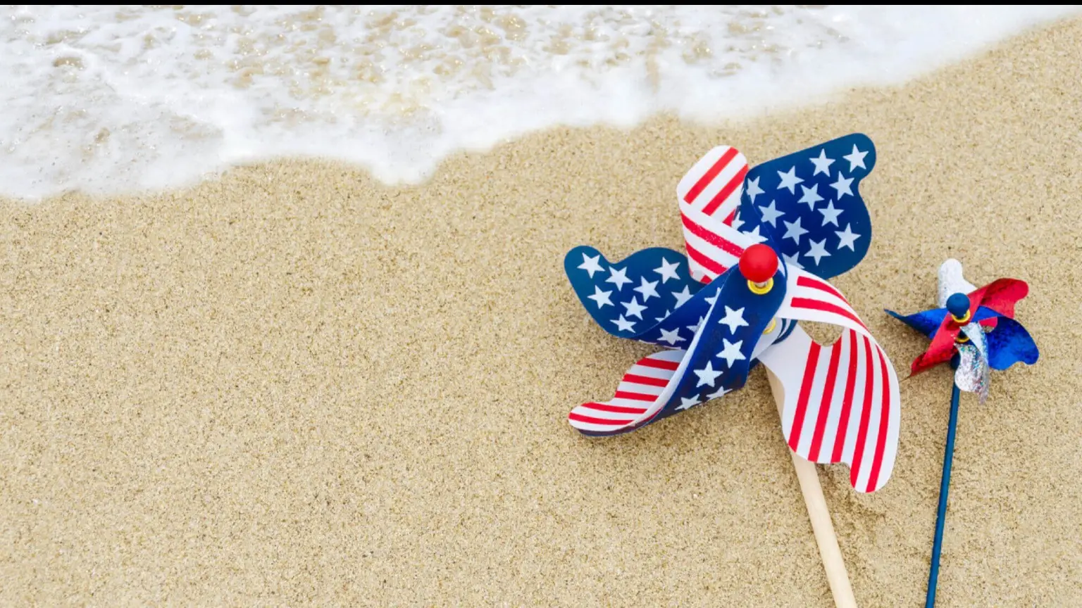 Image: Shutterstock Flag on a sandy beach