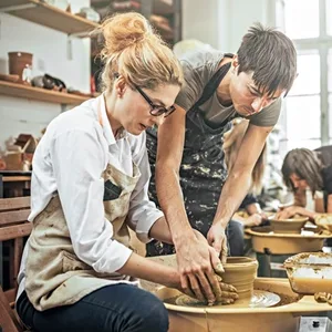 Couple taking a pottery class together