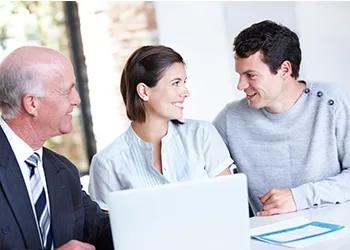Couple doing finances with an advisor