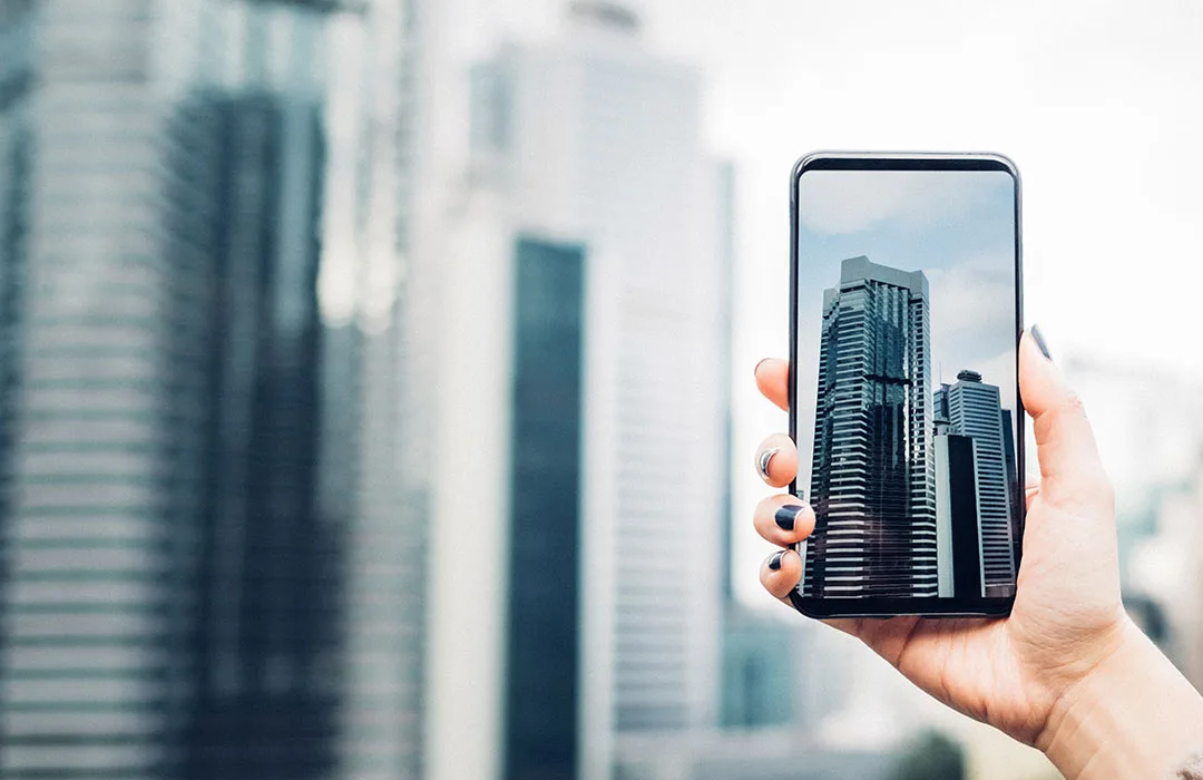 Image: Supplied phone taking photo of skyline