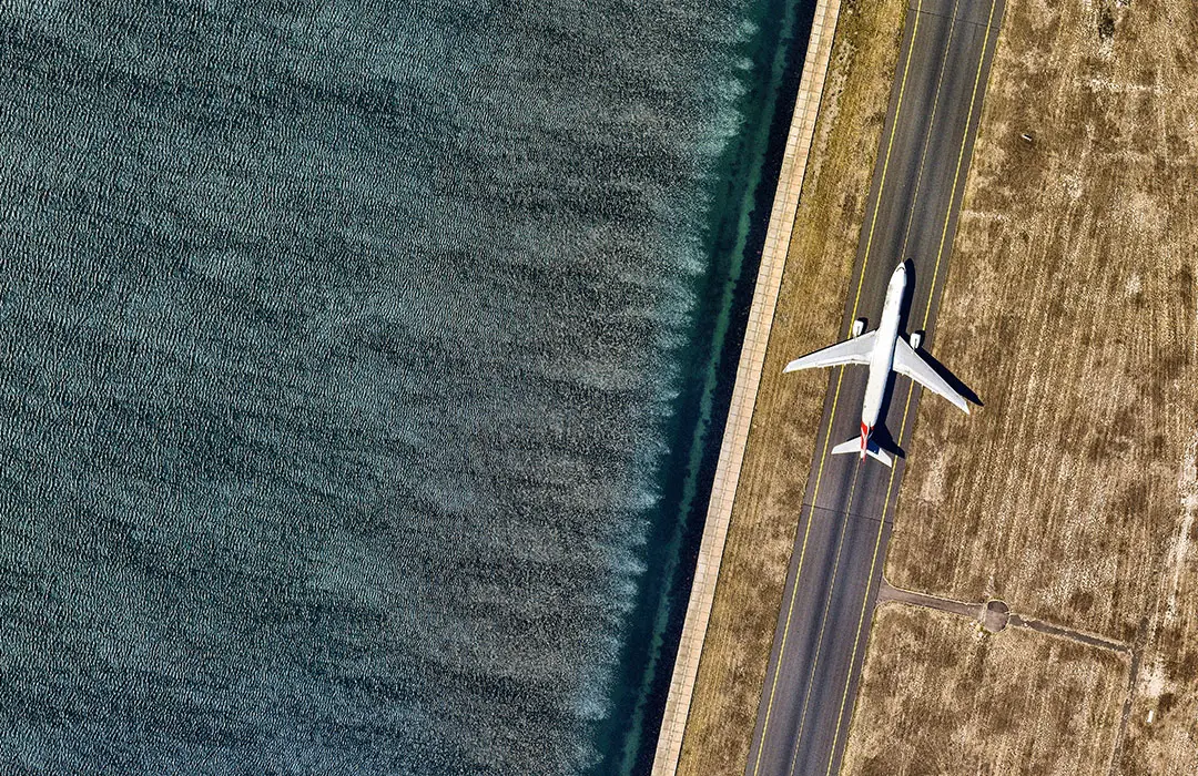 Image: Getty Images Plane On A Runway Next To Water