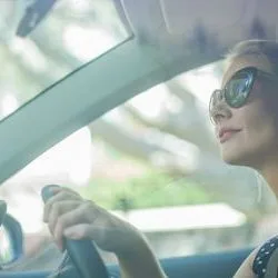 Image: Getty Images Blonde woman driving during daytime