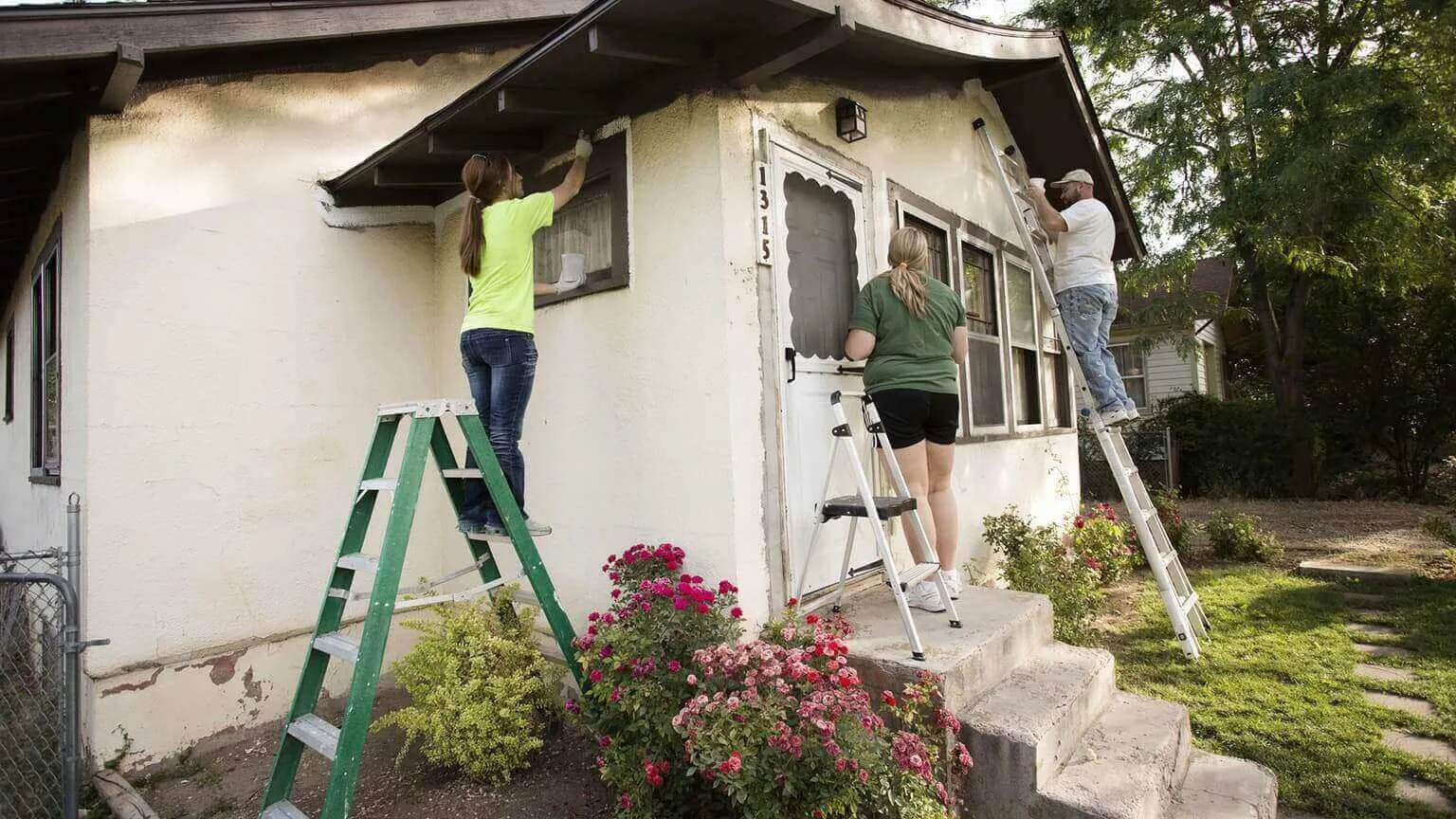 Image: Getty Images People painting house