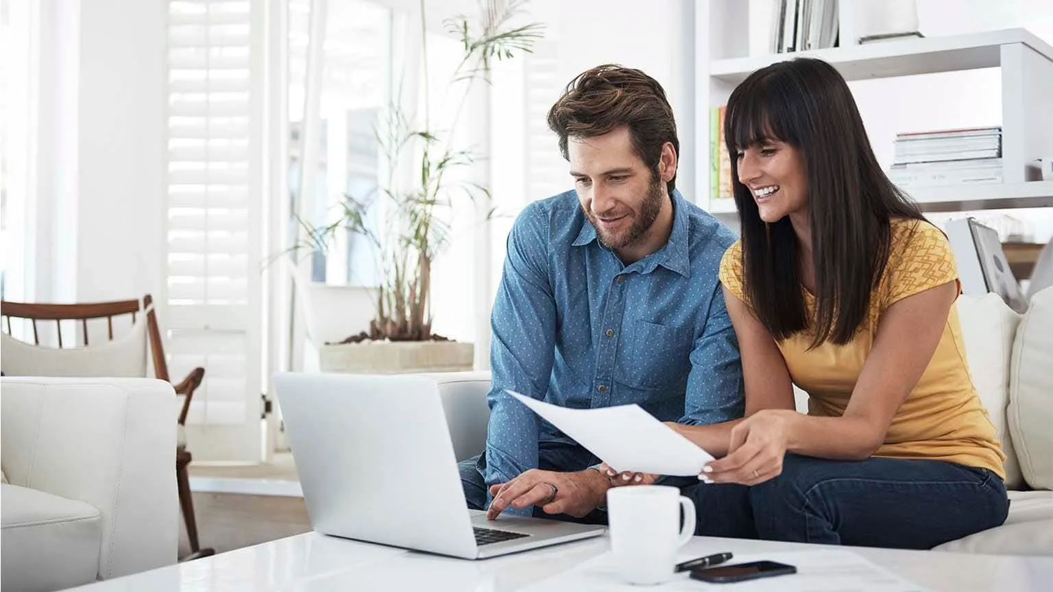 Image: Getty Images Couple looking at her laptop