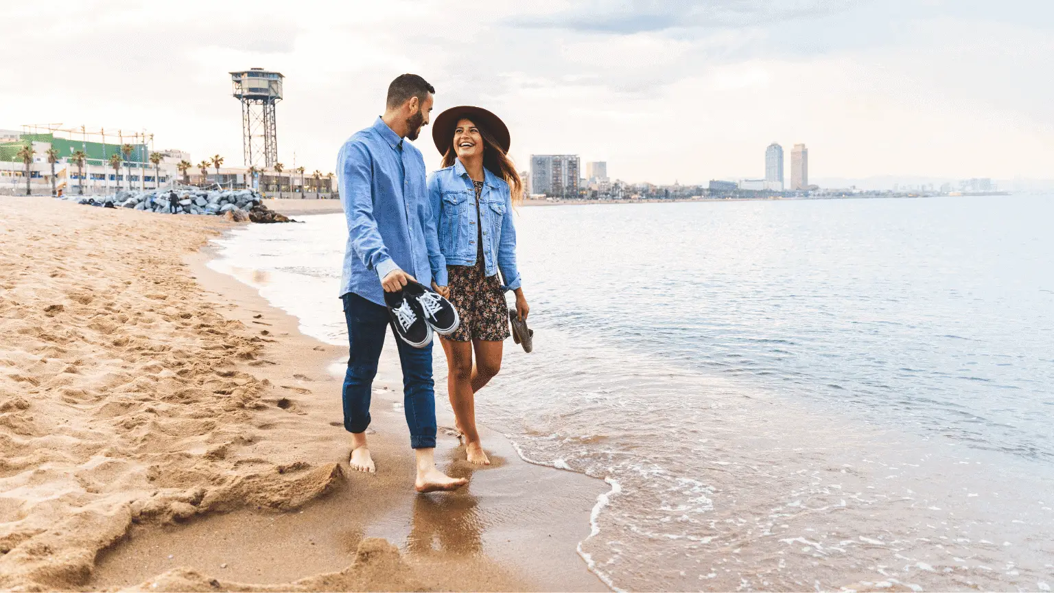 Image: Getty Images Couple walking on the beach
