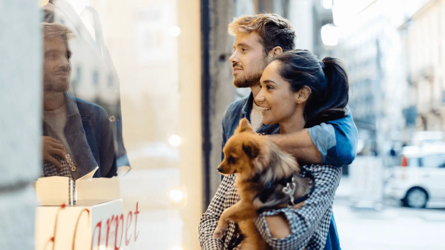Image: Getty Images Couple holding dog