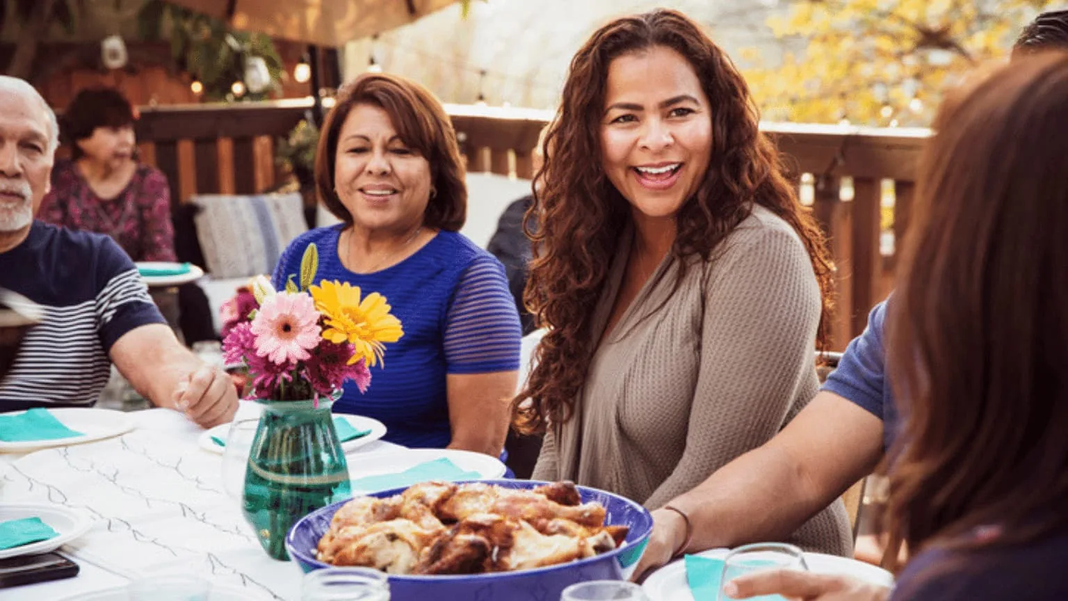 Image: Getty Images Woman with a plate of chicken wings