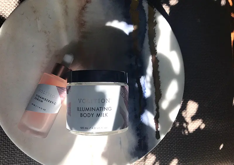 Image: Cheryl Wagemann/Finder Volition Beauty Strawberry-C Brightening Serum and Illuminating Body Milk on a decorative plate