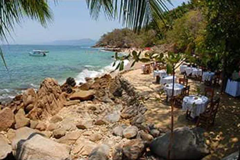 tables set up on beach for dining