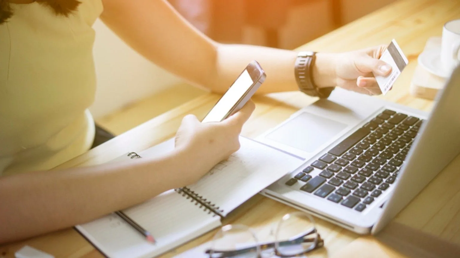 Image: Getty Images Person paying their bills online
