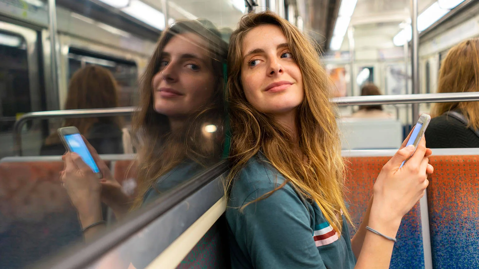 Image: Getty Images Young woman riding the subway