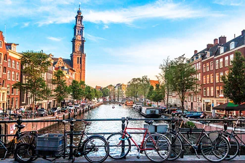 bridge amstel river bicycles amsterdam holland